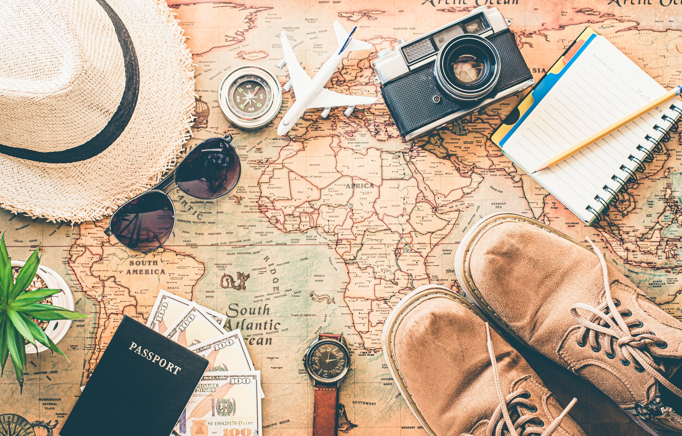 Travel Accessories on Map Background 