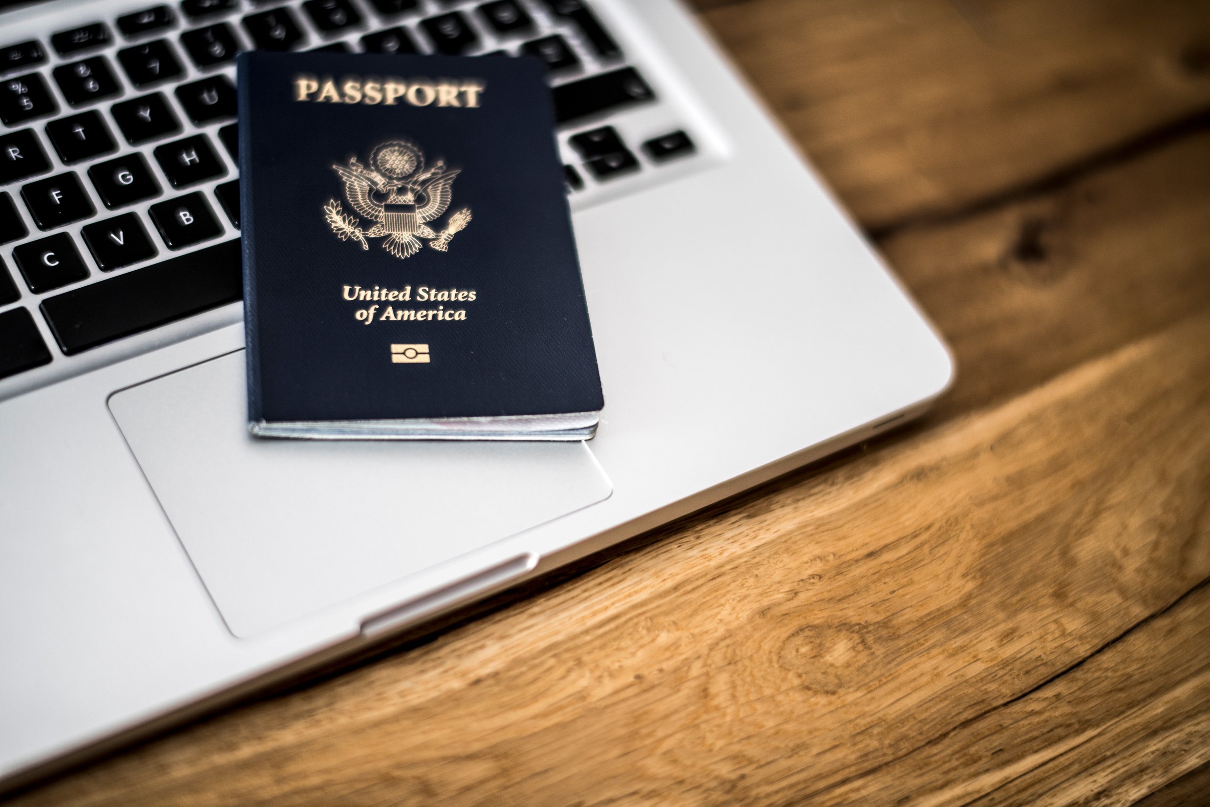 USA passport on laptop computer